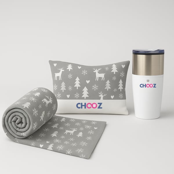 A pampering gift set for employees – includes a cozy blanket, a heating pad, and a thermal mug