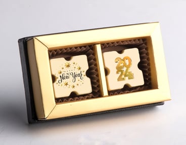 זוג פרלינים איכותיים ממותגים באריזה מהודרת - פרווה/חלבי