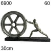 Sculpture of Man Pushing Gear Wheel